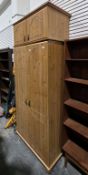 Modern pine two-door wardrobe with matching two-door cupboard above, on bun feet, 221cm high x