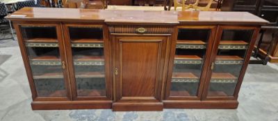 Victorian mahogany breakfront dwarf library bookcase comprising a central curved reeded drawer