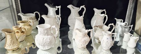 Collection of Victorian pottery relief moulded jugs including Parian examples by Royal Worcester, TR