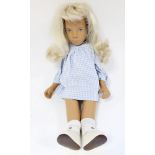 Vintage Sasha doll with blonde hair in blue & white checked dress, socks and white shoes