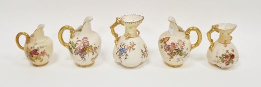 Five late 19th century Royal Worcester blush ivory and ivory ground jugs, printed puce and green