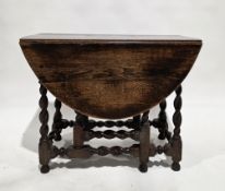 18th century oak oval gateleg table with single drawer to one end, carved shaped frieze, on