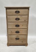 20th century pine chest of five short graduated drawers with brass oval drop loop handles, on