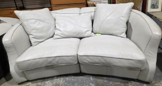 Contemporary white leather sofa of curved form, modular coming in two sections, stitched detail,