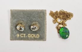 Gold pendant set with oval opal doublet marked 9K, on gilt metal chain and a pair of gold stud