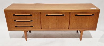 Mid-century Elliotts of Newbury teak sideboard comprising two drop front doors and three drawers,
