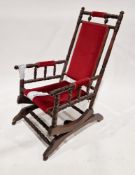 19th century American rocking chair with red upholstery, on a mahogany turned and ringed frame, on