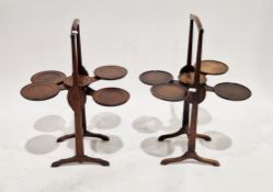 Early 20th century mahogany folding cakestand comprising two swivel shelves and cherry bakelite