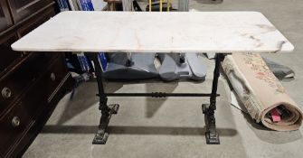 Marble-topped garden/dining table, the pink marble rectangular top with rounded corners, on a