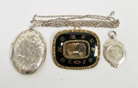 Victorian gilt metal and enamelled mourning brooch with hair decoration beneath the front panel