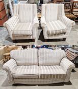Three piece suite upholstered in a grey and gold striped fabric comprising a two seater sofa (two of