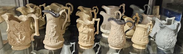 Collection of Victorian pottery caneware and stoneware relief-moulded jugs in sizes, variously