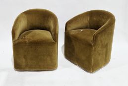 Pair of Alto tub dining chairs designed by Andrew Martin, upholstered in an olive green velvet, on
