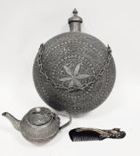 Indo-Persian white metal alloy teapot and cover, a water carrier and a carved horn comb with peacock