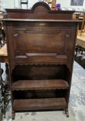 Early 20th century oak student's-type bureau bookcase, the domed top rail over a pull-down front