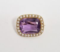 19th century gold-coloured, amethyst and seedpearl brooch, the oblong amethyst surrounded by a