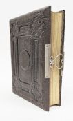 Victorian tooled brown leather photo album, with white metal clasp stamped G.O. 13 October 1881,