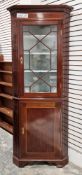Edwardian mahogany and satinwood inlaid corner cabinet, the single astragal-glazed door opening to a