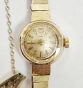 Lady's Tissot 9ct gold bracelet watch, the circular dial with baton markers and the textured