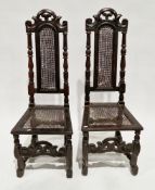 Pair of 17th century oak high-back chairs, having scrolling carved top rail, cane splat and seat,