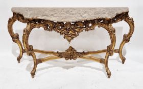 Louis XV-style console table, the shaped marble top over a gilt finished base with foliate scroll
