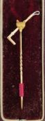 Gold-coloured metal fox head and riding crop stickpin in leather bound velvet and satin lined case