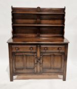 Ercol dark elm Old Colonial dresser, model 331D, the upper section with two plate shelves, over
