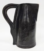 19th century blackjack stitched leather jug of plain form with loop handle, 22cm high Condition