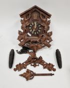 20th century Black Forest cuckoo clock, the wooden carved case with bird and leaf cresting and fox