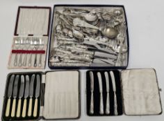 Large quantity of silver plated flatware to include a shell-pattern set and a box of assorted