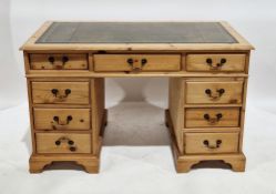 Pine twin-pedestal desk in the George III manner, the rectangular top with green leather inset