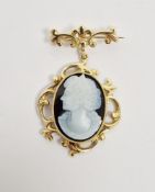 18ct gold brooch, the frame of scrolling design set with pendant cameo depicting a lady in