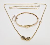 Victorian gold hinged bangle of buckle design, the central square panel set with a diamond, marked