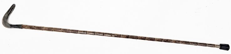 Early 20th century walking stick having a silver handle, hallmarked London 1906, on a faux bamboo