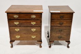 Pair of small oak chest of four long drawers, of rectangular form with brass drop loop handles and