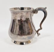 Silver mug by Martin Hall & Co, Sheffield 1923, of plain baluster form with scroll handle, 12cm