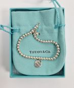 Tiffany & Co silver beaded ball bracelet for a child, with Tiffany & Co silver tag, 7.8cm long