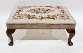 Early 20th century footstool, the rectangular top with woolwork upholstered seat, on oak cabriole