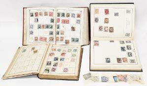 Four early 20th century stamp albums, partially filled with world and European stamps, another later
