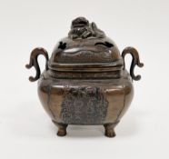 Chinese bronze two-handled censer, probably Qing Dynasty, with a lion dog to the pierced domed