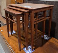 Mid-century Danish inspired teak nest of three tables of rectangular form, on square tapering