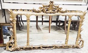 Gilt framed overmantel mirror in the Rococo manner, the three bevelled edged plates contained in a