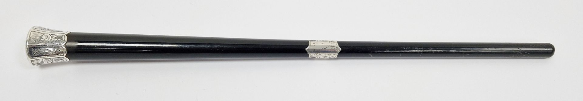 Ebonised conductors baton with silver mounts (unmarked), the terminal engraved 'Presented to Mr A