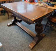 Early 20th century oak draw-leaf table in the Jacobean manner, the rectangular top on substantial