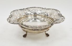 George V silver fruit basket, with everted pierced rim, on three Lion paw feet, Sheffield 1928,