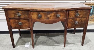 Mahogany sideboard in the regency manner, the top of serpentine outline with cross banded and