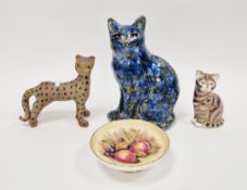 Vintage slip cast pottery model of a cat, in splashed blue, brown and ochre glazes, indistinct