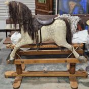 Early to mid 20th century dapple grey painted rocking horse on wooden base, believed to be made