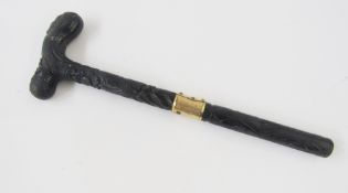 Carved wooden parasol handle, with floral carved decoration and buckle design gold-coloured metal