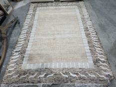 Indian cream ground rug with geometric borders 290cm x 200cm